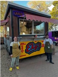Eky's food cart with customers